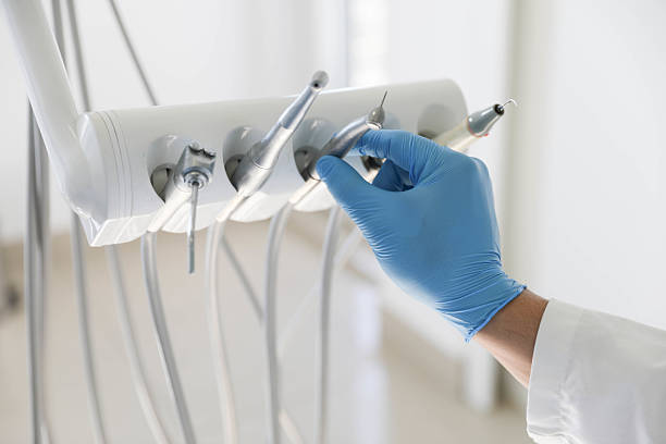 Professional Tooth Extraction technician working in Old Bethpage, NY